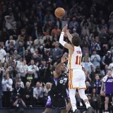 Trae Young a réussi l'un des tirs de la saison à Salt Lake City. KEYSTONE/AP/Rob Gray
